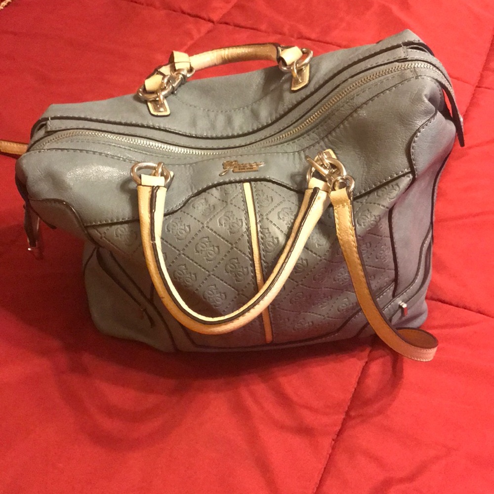 Guess light blue crossbody bag with dual handles.